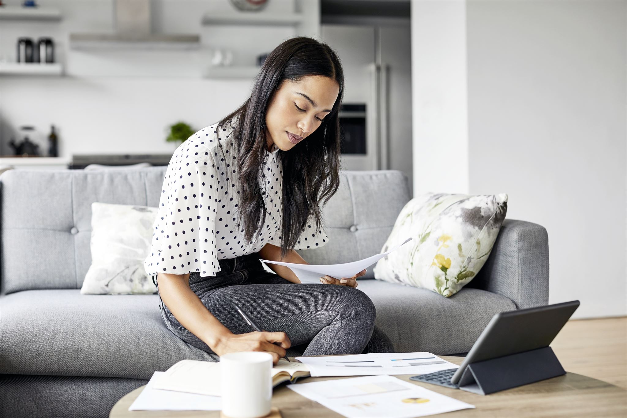 Smiling woman reviewing insurance documents