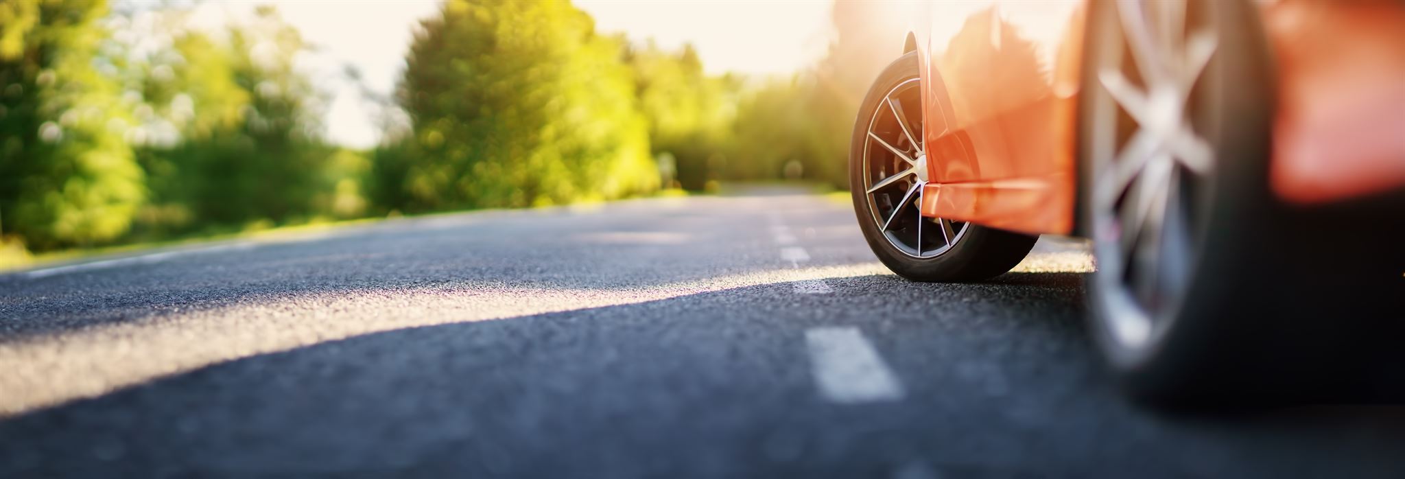 Car on road with sunset background